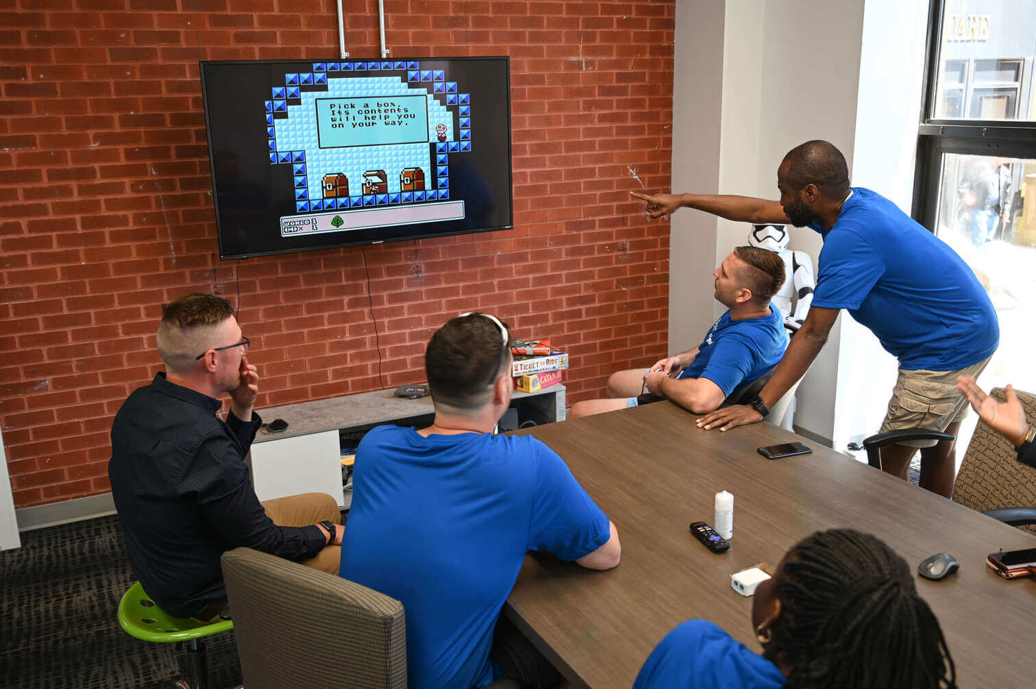 PF team playing mario in the office