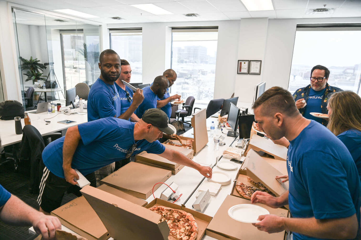 PF team eating pizza